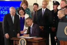 President Obama signing an executive order on July 21 against hiring discrimination by federal contractors. Public domain image