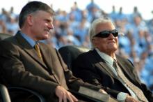 Evangelist Franklin Graham with his father, Billy Graham, at the elder Graham’s final crusade in New York in 2005. Photo via RNS Photo via RNS