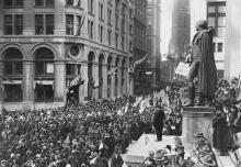 "Thousands gather at the Subtreasury Building on Wall Street during Armistice Day, 1918." Crowds gather at the Subtreasury building on Wall Street for Armistice Day 1918