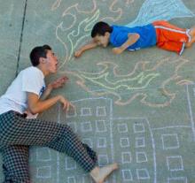 The chalk drawing by Wes Noyes, 17, with his superhero brother, Jonah, 8. The chalk drawing by Wes Noyes, 17, with his superhero brother, Jonah, 8.