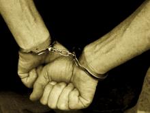 Hands in handcuffs, Digital Vision. / Getty Images Hands in handcuffs, Digital Vision. / Getty Images