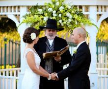A bride and groom take their vows on a beach. Photo courtesy of Lon M. Burns, Universal Life Church Photo courtesy of Lon M. Burns, Universal Life Church