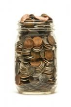Jar of coins. Photo courtesy Balefire/shutterstock.com