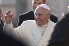 Pope Francis waves to a crowd at St. Peter's Basilica. giulio napolitano/Shutterstock giulio napolitano/Shutterstock