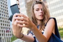 Young woman taking a selfie, Linda Moon / Shutterstock.com Young woman taking a selfie, Linda Moon / Shutterstock.com