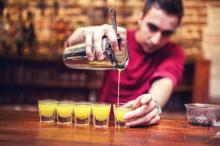 A bartender pours shots. Photo courtesy of bogdanhoda via Shutterstock / RNS Photo courtesy of bogdanhoda via Shutterstock / RNS