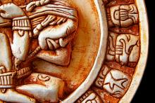 Close-up of the glyphs on the Mayan calendar. Close-up of the glyphs on the Mayan calendar.