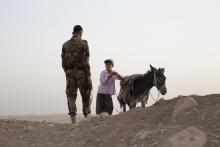 Assyrian Christian militia member speaks with a shepherd in the Nineveh plains of Iraqi Kurdistan. Photo via Jodi Hilton/RNS.
