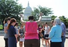 Sojourner staffers praying outside the Capitol building on behalf of the Evangelical Immigration Table in June. Photo by RNS. Photo by RNS.