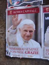 A poster of Pope Benedict XVI on the streets of Rome. The conclave will begin on Tuesday. RNS photo by David Gibson RNS photo by David Gibson