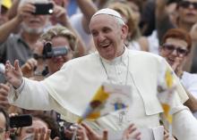 Pope Francis greets a crowd in St. Peter’s Square at the Vatican on Sept. 11. 2013. Photo by Paul Haring/Catholic News Service.