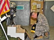 Army Chaplain Capt. Joseph Odell mourns a fallen soldier in Afghanistan. RNS photo courtesy Joseph Odell. Army Chaplain Capt. Joseph Odell mourns a fallen soldie. RNS photo via Odell.