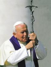 Pope John Paul II participates in a procession in August, 2000. RNS file photo courtesy Universal Press Syndicate.