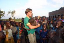 Jason Russell with Ugandan children in the film “Invisible Children.” RNS photo courtesy of Invisible Children.