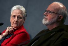 Irish abuse victim Marie Collins, left, looks at Cardinal Sean Patrick O’Malley. Photo via REUTERS / Alessandro Bianchi / RNS Photo via REUTERS / Alessandro Bianchi / RNS