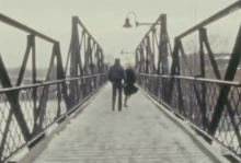 Polley's parents dance along a snowy bridge. Screenshot from Stories We Tell.