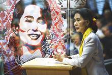 Aung San Suu Kyi delivering a lecture and street art of her. JolieNY and Krzysztof Kuczyk/Flickr JolieNY and Krzysztof Kuczyk/Flickr