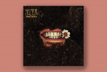 The image shows the cover of Hozier's album, "Unreal Unearth" which shows his smiling mouth coming out of the soul with a daisy in his teeth. 