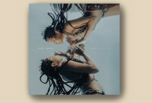 The image shows the album cover of Jamila Woods' album "Water Made Us," in which she is starring at her reflection in the water. 