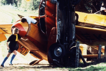 A still from the film Weekend where the characters are climbing and exploring a grounded plane.