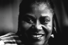 Black and white photo of Bernice Johnson Reagon smiling into the camera.