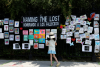 A child looks at the “Naming the Lost Memorials” at The Green-Wood Cemetery in Brooklyn, N.Y., on June 10, 2021. REUTERS/Brendan McDermid.